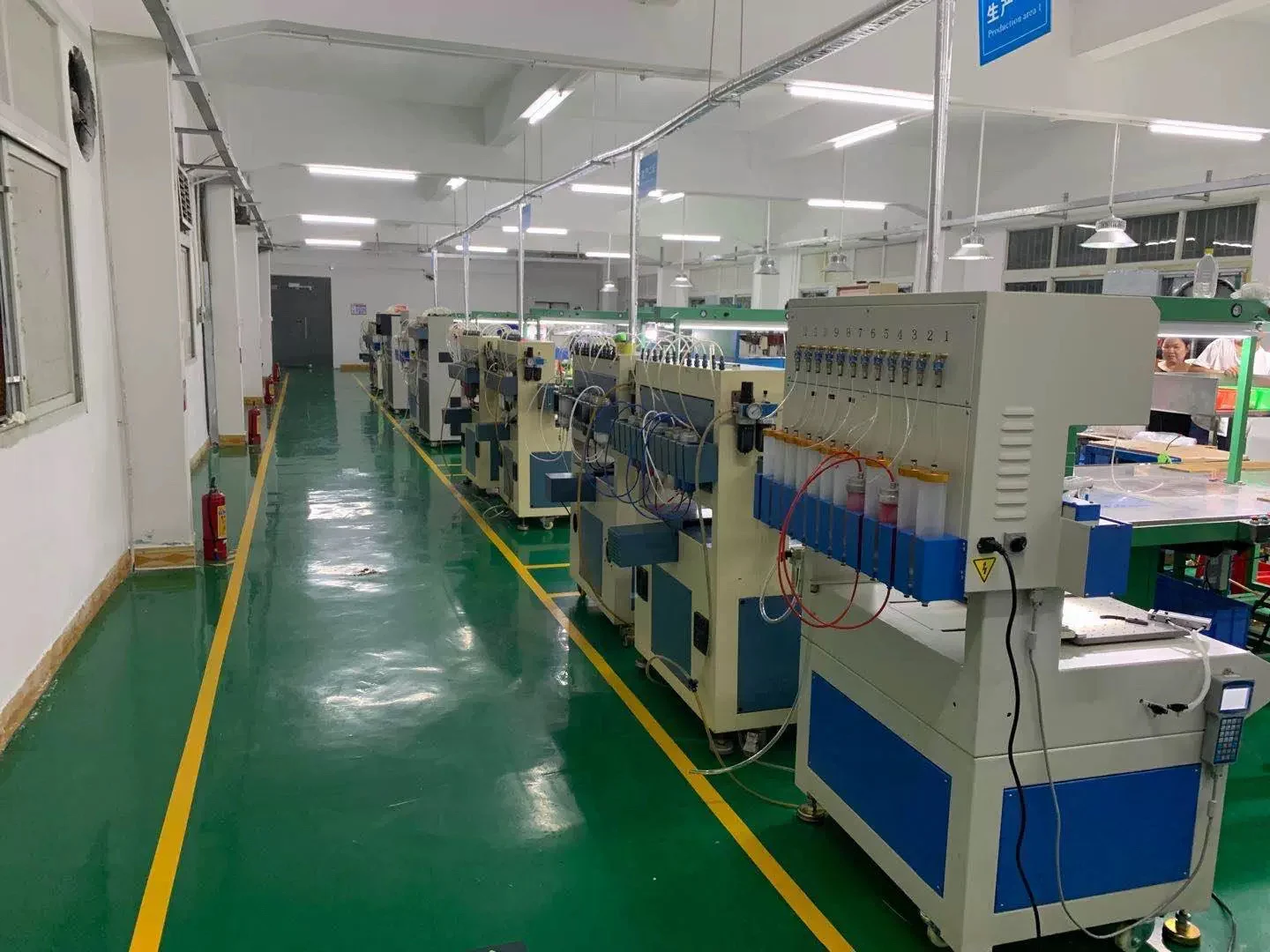 Dispensing equipment arranged along a production aisle in the Jarhouse Life factory