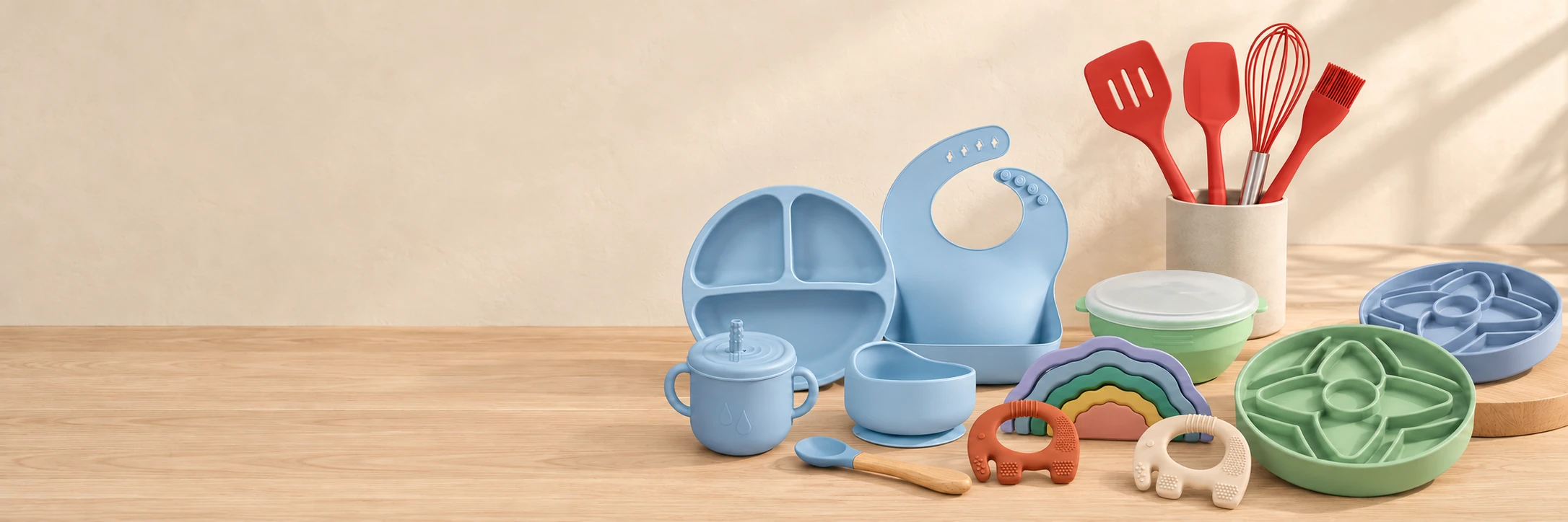 Silicone baby feeding sets, elephant teethers and rainbow toys with kitchen utensils and pet slow feeder bowls